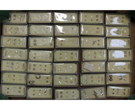A large collection of new old stick sterling silver earrings, in plastic / cardboard cases, generally 3 pairs per box (35). B