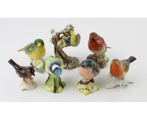 A collection of Beswick, W Goebel and similar manufactures birds. To include Blue Tit, Robin, Greenfinch and others. (7)  Of 