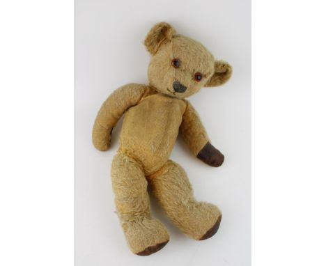 A vintage teddy bear. Height 42cm.