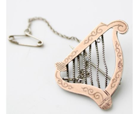 Gold on silver brooch in the form of a harp / lyre, 5g.