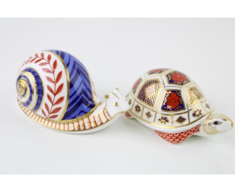 Two Royal Crown Derby paperweights, Snail and a Turtle, both first quality with stoppers (2).  In good condition with no obvi