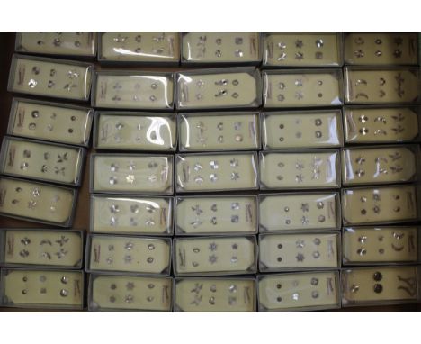A large collection of new old stick sterling silver earrings, in plastic / cardboard cases, generally 3 pairs per box (35).  