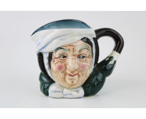 Small Sairey Gamp character jug, in unusual lighter blue colourway, unmarked, in the style of Royal Doulton, 8cm tall.  In go