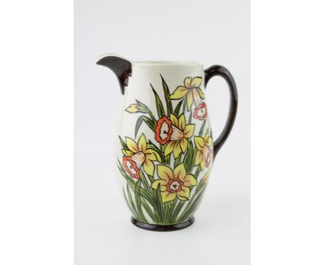 A Oldcourt Ware jug by Lorna Bailey, Daffodils design, height 21cm.  Of first quality with no obvious signs of restoration or