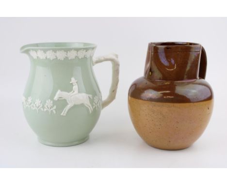 A Copeland Spode K916 pale green glazed jug with applied relief decoration of man on horseback with dogs chasing fox together