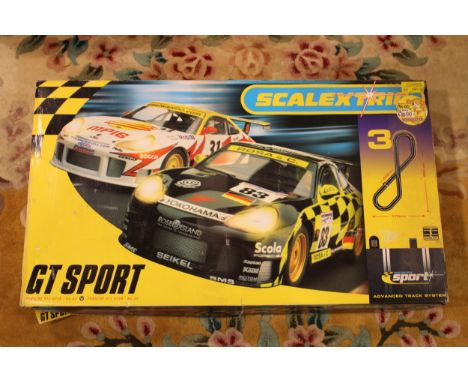 A boxed Scalextric GT Sport set, Advanced Track System with Porsche 911 GTR3 / No 83 and 911 GTR3 / No 31 cars.  Boxed comple