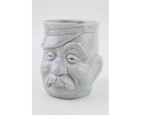 World War One era pottery character jug of Bruce Bainsfather, light blue glaze, 11cm tall, unmarked.  In good condition with 