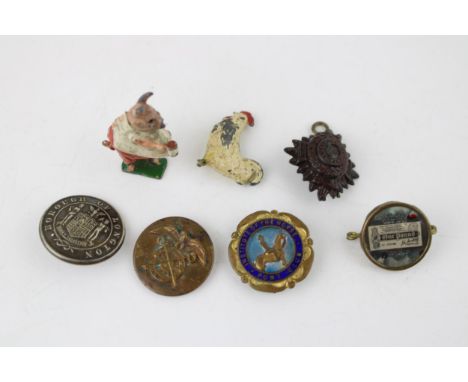A Souvenir of the great war one pound 1914 aid badge and Britains cocoa cubs figure longton button etc