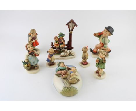 Goebel Hummel figures to include Wayside Devotion, Girl with Picnic Basket, Merry Wanderer, Girl with Rucksack, a wall pocket