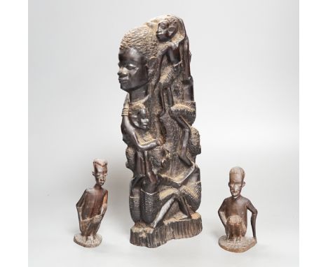 Four tribal hardwood carvings, two bows and two bronze spears longest 85cm