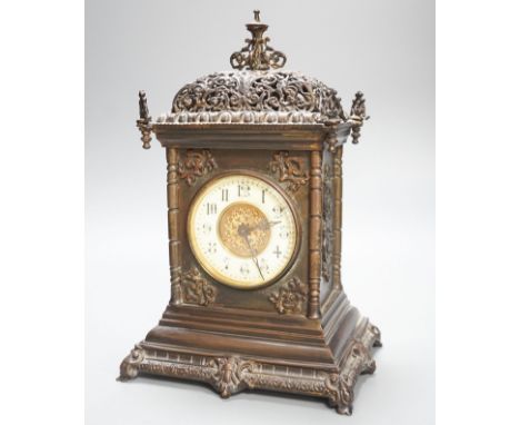 An Edwardian patinated brass mantel clock with key 30cm