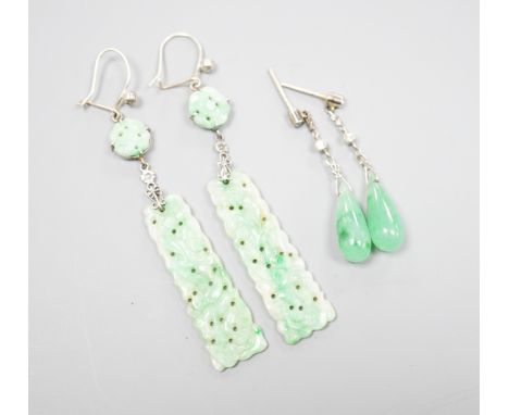 A pair of white metal pair shaped jade and two stone diamond set drop earrings, 37mm and one other pair of carved jade drop e