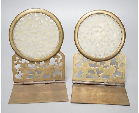 A pair of early 20th century Chinese bowenite jade mounted brass bookends 16cm tall
