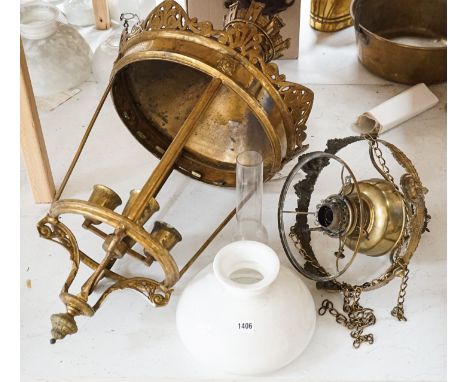 An Edwardian brass hanging oil lamp with opaque shade, overall drop 80cm Together with a large brass hall lantern