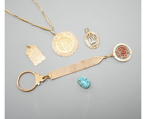 A Middle Eastern yellow metal and enamel pendant on a similar clip and three other Middle eastern pendants, one with chain, g