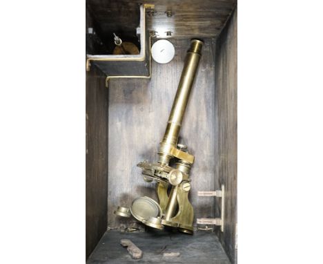 A Baker High Holborn London brass monocular microscope and another brass microscope, both boxed with accessories, largest 43c