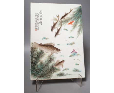 A Chinese famille rose porcelain rectangular plaque, Republic period (1912-49), painted with fish in a pond amid weed and ins