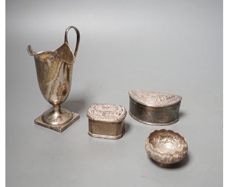 A Edwardian silver helmet shaped cream jug, Mappin &amp; Webb, London, 1905, 13.1cm and three Indian white metal items includ