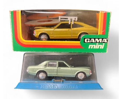 Gama (Germany) 1/43rd scale Ford Consul GT Coupe metallic gold with tan interior, roof rack and two kayaks No. 9961 and Grana