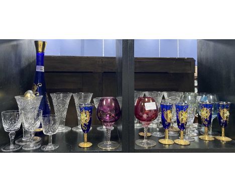 BOHEMIAN BLUE GLASS DECANTER AND SIX GLASSES, with gilt and enamel decoration, along with crystal and coloured glass drinking