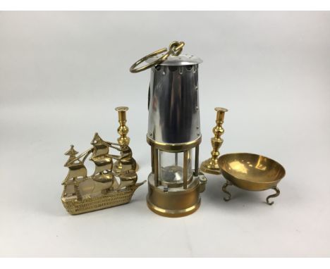 THE PROJECTOR LAMP &amp; LIGHTING CO MINERS LAMP, 24cm high, along with brass ware including a pair of candlesticks and two C