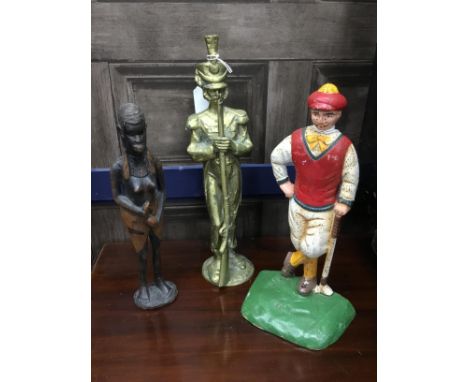 PAINTED CAST IRON FIGURE OF A GOLFER, 26.5cm high, along with a figural candlestick, brass figure of an Infantry guard, Afric