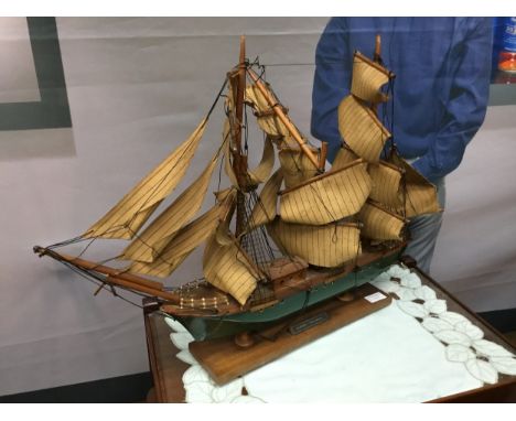 ‘CLIPPER’ STAINED WOOD MODEL SHIP, on stained wood base, along with six other model ships and a pair of bookends mounted with