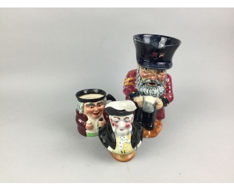 TWO ART DECO STYLE CERAMIC WALL MASKS, each modelled as the face of a gentleman, the larger 22cm high, along with a lidded ce