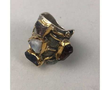 GEM SET RING, with uncut gems including tourmaline, labradorite, carnelian and amethyst, 30mm long, size Q, marked 925, 17.5g