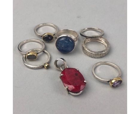 COLLECTION OF GEM SET RINGS, including amethyst, peridot, sapphire, kyanite, along with a 22.00 carat ruby pendant, each in s