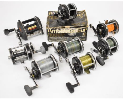 A collection of vintage Abu Ambassadeur multiplier fishing reels, various model numbers including 9000C, two 10,000CA, two 80
