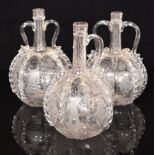 Three of Victorian glass decanters, all with engraved windmills, ships and vines, tallest 24cm