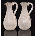 Pair of Victorian crackle glass jugs with ice cooling compartments and applied twist handles, 29cm