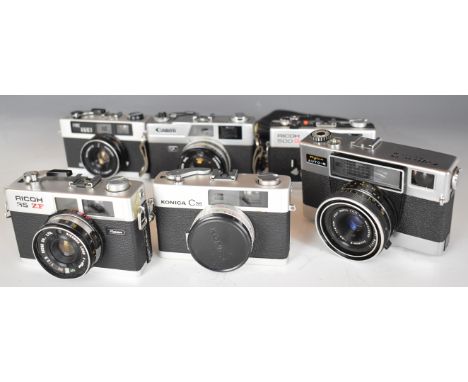 Six 35mm film cameras comprising Canon QL, Fujica Auto-M, Ricoh 500 GX, Ricoh 35 ZF, Prinz 35-E and Konica C35