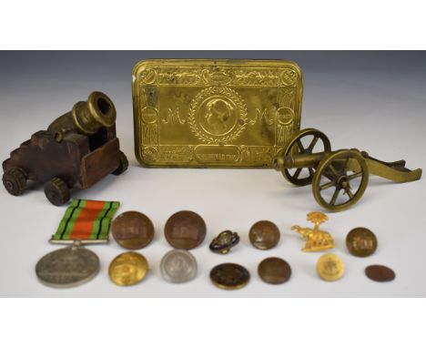 WW1 Princess Mary Christmas tin, WW2 Defence Medal, two small brass cannon and Royal Inniskilling Fusiliers buttons etc