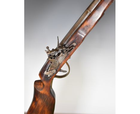 Flintlock cavalry carbine rifle with dog safety, shaped stock, brass trigger guard and 25 inch smooth bored part-octagonal ba