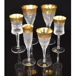 Six Moser Splendid pattern wine glasses and champagne flutes, each with cut body and stem and gilt