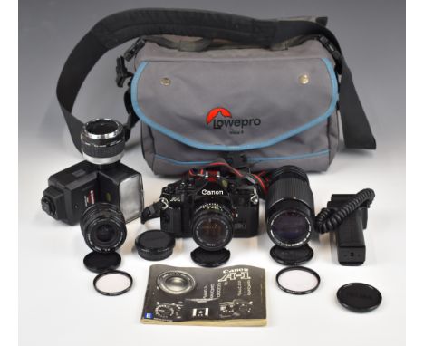 Canon A-1 35mm SLR camera outfit including Canon 50mm 1:1.8, Sigma 28mm 1:2.8 and Canon 70-210mm 1:4 lenses, flash gun, instr