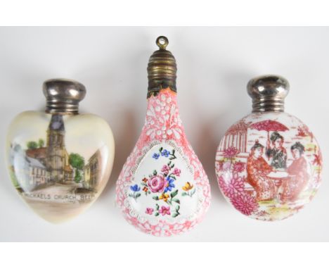 Three 19thC porcelain and enamel scent / perfume bottles, two with hallmarked silver mounts including 'St Michaels Church, Be