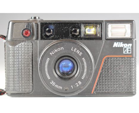 Nikon FE with 28mm f/2.5 Soligor Wide-Auto Lens and 52mm and Nikon discount Flash