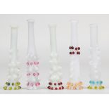 Five opalescent glass cheroot holders with ribbed and applied decoration, 5.5cm long.