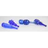 Four blue glass cheroot holders two with applied decoration, largest 9cm long.
