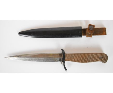 Possible WW1/WW2 fighting knife with chequered wooden grips, 14.5cm blade and metal scabbard. PLEASE NOTE ALL BLADED ITEMS AR