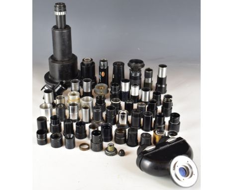 Lenses and eyepieces to include Carl Zeiss binocular eyepiece, Russian lenses and Baker London microscope lens