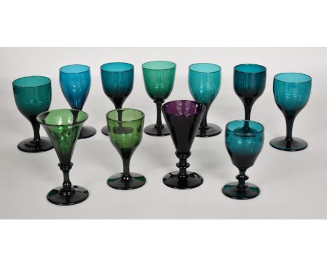 Eleven Bristol style late 18th/ early 19thC green and amethyst glass drinking glasses, some with knopped stems, largest 13cm 