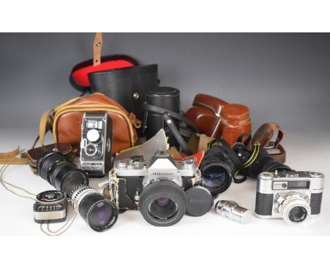 Collectable cameras to include Paillard Bolex BH8 cine camera with three various lenses, manuals etc, Nikkormat FT2 with 50mm