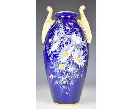 Royal China Works Worcester Grainger and Co twin handled vase decorated with ox eye daisies on a dark blue ground, height 19.