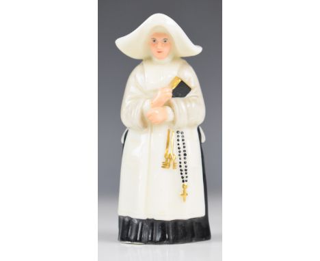 Royal Worcester candle snuffer modelled as a nun, with puce mark to base, height 9.5cm