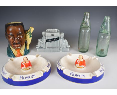 Two Carltonware advertising figural Shakespeare 'Flowers Keg Bitter' ashtrays, Martin Luther King with dove character jug, Wa