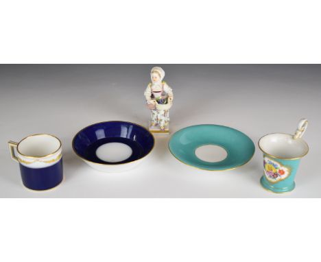 Meissen figure of a girl with basket of grapes and two Meissen cups and saucers, tallest 10cm